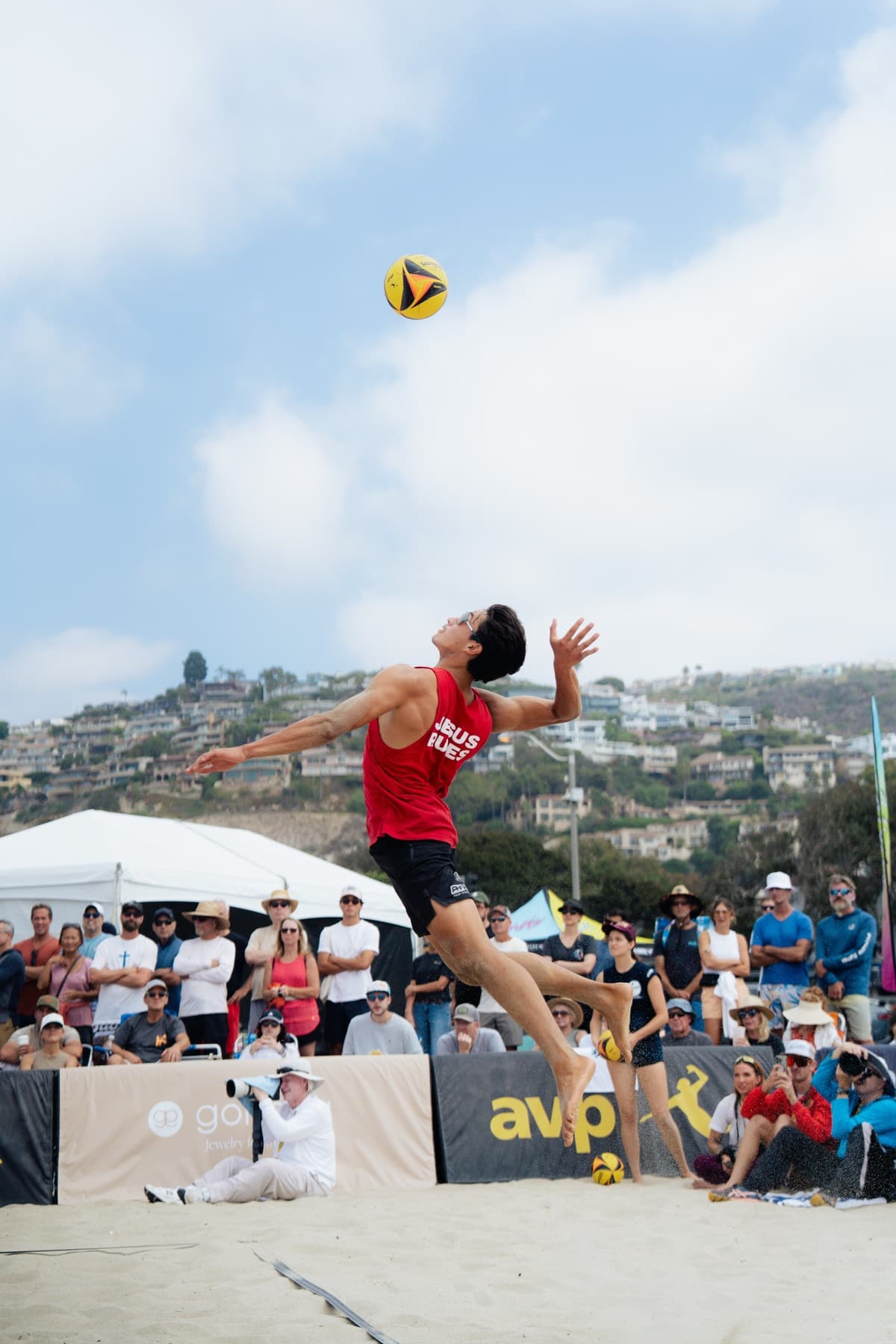 Diego Perez serving on the AVP pro tour